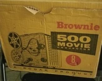 This is an old movie projector, it the original box and it is in great condition