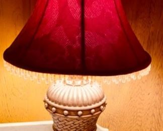 Urn style table lamp with red silk shade