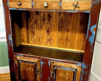 Whimsical cabinet of reclaimed wood