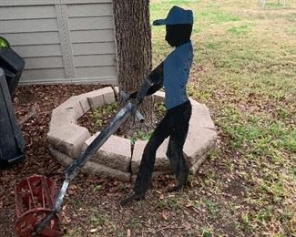 $95 ~ HEAVY CUT OUT METAL MAN MOWING 
