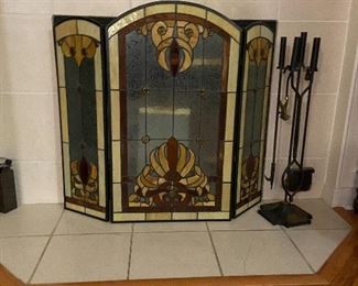 Stained glass fireplace screen and iron fireplace tools