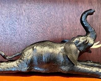 Item 15: Vintage Leather Reclining Elephant - 16" x 9": $42