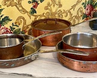 Item 283: Vintage Dansk Polaris Copper with Stainless Steel Interiors: a. 5 3/4" Saute (top left): $55 b. 10" Frying pan (left): $68 c. 2.5 qt. Pan with cover (back middle): $65
d. 9" Frying pan (bottom right): $55 e. 6 3/4" Saute (top right): $55