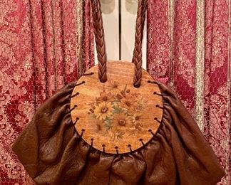 Item 310: Leather Bag with Painted Wood and Pink Satin Interior: $85