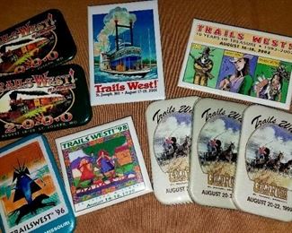 Trails West items. Badges, T-shirts, posters