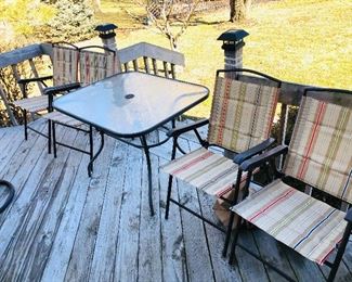 Patio table and 4 fold up chairs 