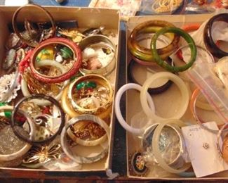 There are at least 2 carved Bakelite bangles in there.