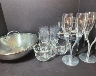 Four beautiful Moet and Chandon champagne glasses with two holder. The glasses and holder are made for each other perfectly as the glass does not have a flat base. Wok, four glasses and two glass mugs all have an etched wispy flower design on glass.

https://ctbids.com/#!/description/share/752992