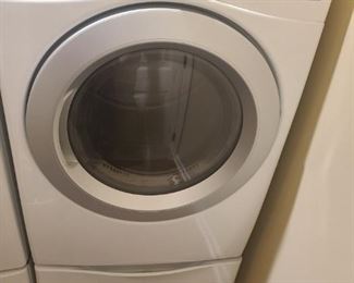 LG front load sensor electric dryer. Pedestal has a partition that can be removed to provide storage for wider things. Measures 27" x 27" x 53". Matching washer is also in sale.

https://ctbids.com/#!/description/share/752988