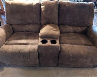 Ashley furniture microfiber loveseat with electric reclining features. Measures 78" across, 38" high at back, 18" at seat. See matching sofa and chairs.

https://ctbids.com/#!/description/share/752985