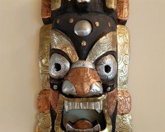 This is a beautiful Tibetan mask purchased at 10,000 Villages. It measures 15"x9.5"x5". Its made out of wood with added decorative bronze, copper, and tin.

https://ctbids.com/#!/description/share/752923