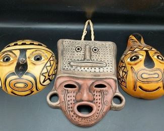 Three hand crafted masks from Chile and two vicuna furs. Round Gourd: 6.5" diameter, 2" out from wall Ceramic (Ten Thousand Villages): 9.5"x8"x2" Long Gourd: 8"x5"x3" Furs: 42" at longest, 22" at widest

https://ctbids.com/#!/description/share/752917