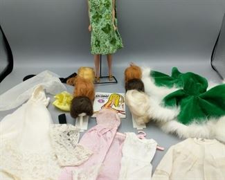 Any Barbie collector will love this Fashion Queen Barbie with six wigs, Skipper book, homemade dresses. Barbie has “Midge 1962 and Barbie 1958” stamped on tush.

https://ctbids.com/#!/description/share/752913