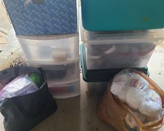 Three totes full, a three drawer rolling plastic storage, three bags full of yarn and three instructions and how to books.

https://ctbids.com/#!/description/share/753059