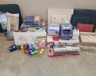 Five scrapbooks of different sizes. A Sizzix machine that cuts paper, rubber, magnet, sponge and more so you can make shapes or letter for your scrapbook and other projects. Xyron 250 makes stickers, and Creative memories binder has tons of stickers and scrapbook materials.

https://ctbids.com/#!/description/share/752882