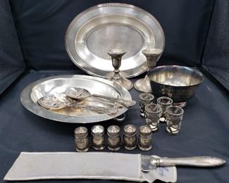 Includes sterling salt pots (2"H), utensils (9"L), bowl (3"H x 5"L), dishes (12"L x 9"W), Towle weighted sterling candle stick holder set (4"H) and Mexican shot glasses (2"H).

https://ctbids.com/#!/description/share/752841