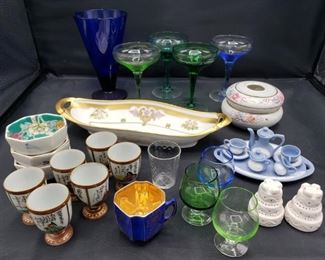 Includes miniature tea set, salt and pepper shakers, sake set, dish, candle holder and glasses. Tallest measures 6"H and shortest measures 2"H. https://ctbids.com/#!/description/share/753006