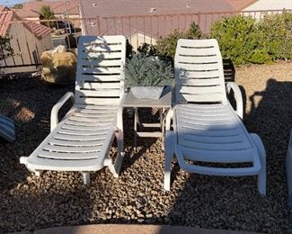 Pair of resin lounges