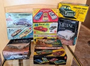 Vintage Model Car Sets. Some of the boxes are damaged as pictured and unknown if all pieces are included in each set.