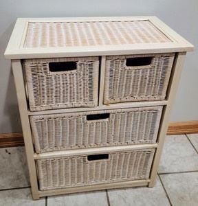 Small Wicker Storage Dresser. Some light wear as pictured. Measures 25.5” wide, 15” deep and 31.5” high.
