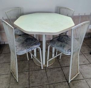 Vintage Patio Set. Some wear as pictured, but could be a fun refinishing project! Measurements:

Table: 44” in diameter and 36” high 

Chairs: 18” wide, 25” high to the seat and 31” high to the chair back.