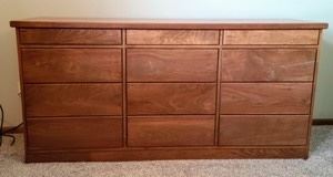 Wooden Dresser. Nice dresser matches the previous lot. Some light scratches as pictured, but in otherwise great condition. Measures 73.5” wide, 18.5” deep and 36” high.