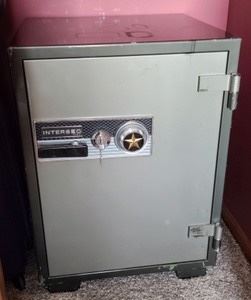 Intersec Safe. There is keys to open the safe, but no combination. There is a manual with information on requesting a new combination. Some light paint wear on top as pictured. Measures 18” x 21” and 29” high.
