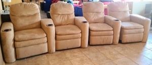 Microfiber Reclining Theater Sofa. Each piece is not attached and makes for easy moving! There are some light spots and stains as pictured. Measures 144” wide, 33” deep, 20” high to the seat and 38” high to the chair back.
