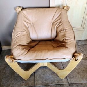 Unique Leather Chair. Super cool chair! There’s a few small spots as pictured. Measures 29” wide, 30” deep, 17” high to the seat and 28” high to the chair back.