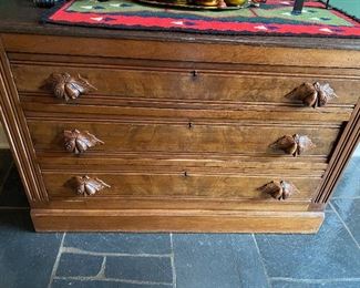 Lot 6: $165- Oak chest of drawers with burl veneer drawer fronts and carved pulls. Dark oak top. 40"W x 26-1/2"H x 17-1/2"D