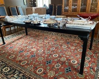 Lot 21: $250- Davis Cabinet Ebony dining table #1555 with 2 leaves. 64"L -96"L (leaves are 16" each)