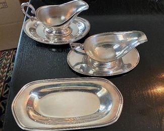 Lot 67: $30- Lot of 2 gravy boats with underplates and one oblong dish Sheffield 826-all silver plated