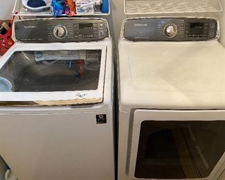 Lot 107: $600- Samsung washer and dryer. 2015 models 46"H x 26-1/2"W each