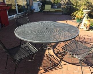 Wrought iron patio table and four chairs.