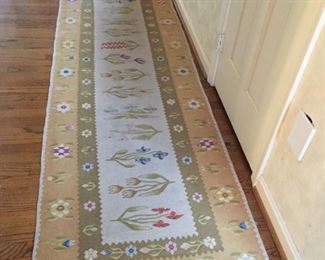 Floral runner made in Romania.