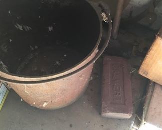 Cast iron bucket with handle. Calvert bricks.