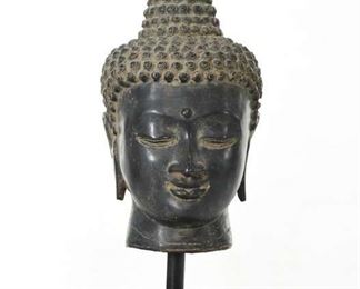 Small Buddha'S Head Statue Mounted On Stand