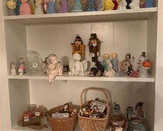 Top shelf is Avon lady perfume bottles while bottom 2 shelves are various figurines