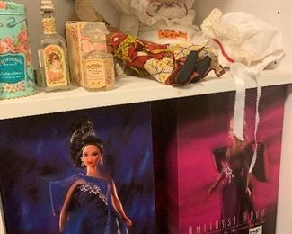 On top shelf is unusual 2 face porcelain doll and bottom shelf has Bob Mackie Barbie dolls