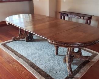Beautiful Round Ornate Table with Three Leafs (shown extended). Medium Size Carpet