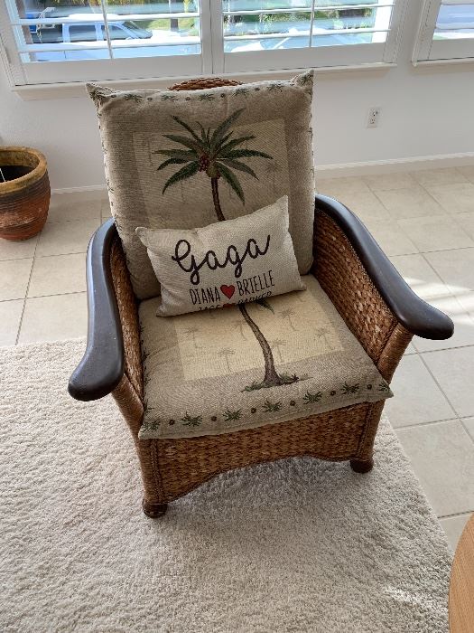 Wicker chair with palm tree cushions 