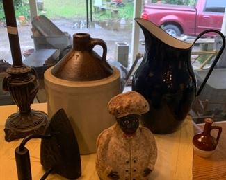 It looks like that pitcher is black and white but it's actually Cobalt Blue and white.  Made in Poland, which apparently makes it more special than ones not made in Poland. That moonshine jug was made in the USA.