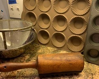 We have no idea what this is.  We're pretty sure it's meat tenderizer but it looks like someone took a rolling pin, cut it in half then screwed the bottom of a cast iron golf shoe on there.  We're not complaining or anything just wondering why?