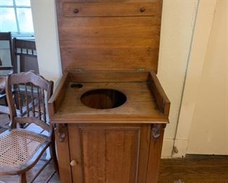 One of us said this was an old toilet. One of us said this was a Victrola cabinet.   I say who are we to define this piece of furniture.  Why can't it be both.  