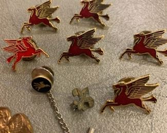 Why is one of the pins facing a different direction?  Is he the leader?  Is he better than the others?  Who knows.  Also that is a 24k gold Mobil Pegasus Tie Pin.  Which I almost threw away cause I thought it was a crappy piece of jewelry - so you know, don't just things by their appearance.  