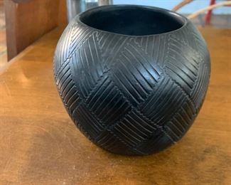 This blackware pottery vase is signed E. Bigmeat.  This is apparently called the Friendship pattern.  Likely never to be confused with the Pyrex Friendship pattern of red and orange birds and flowers.  