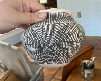 This vase is signed by S. Antonio, Acoma NM.  It's got a great black and white starburst pattern.  