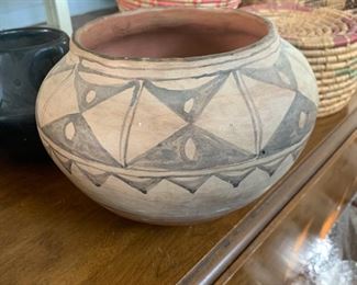 This piece is unsigned but the design, colors and style appear to be Santo Domingo pueblo pottery, but I can't be sure.  There is just something about it that I like though.
