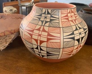 This Jemez pottery vase is signed Dorela Tosa.  The colors and pattern are amazing on this one.  