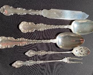 Sterling silver, Strasbourg cake saw, serving spoons, olive spoon & pickle fork